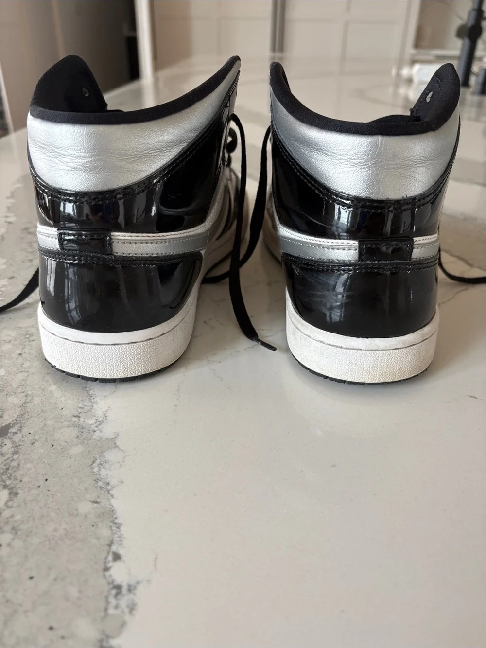 Like new Nike Black patent, silver and White Mid AirJordan